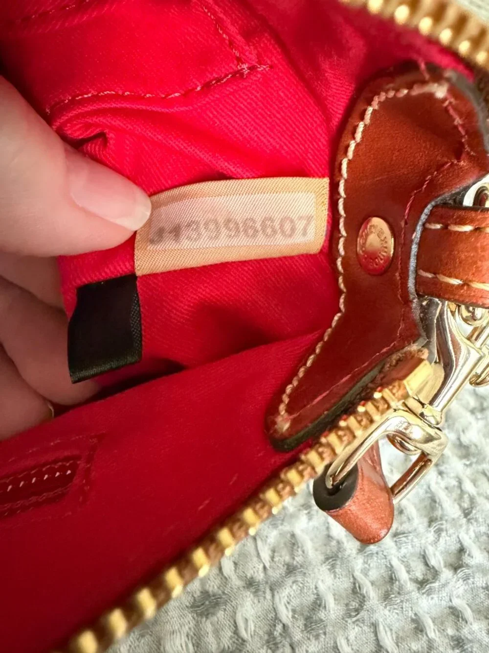 Dooney & Bourke •	zipper closure